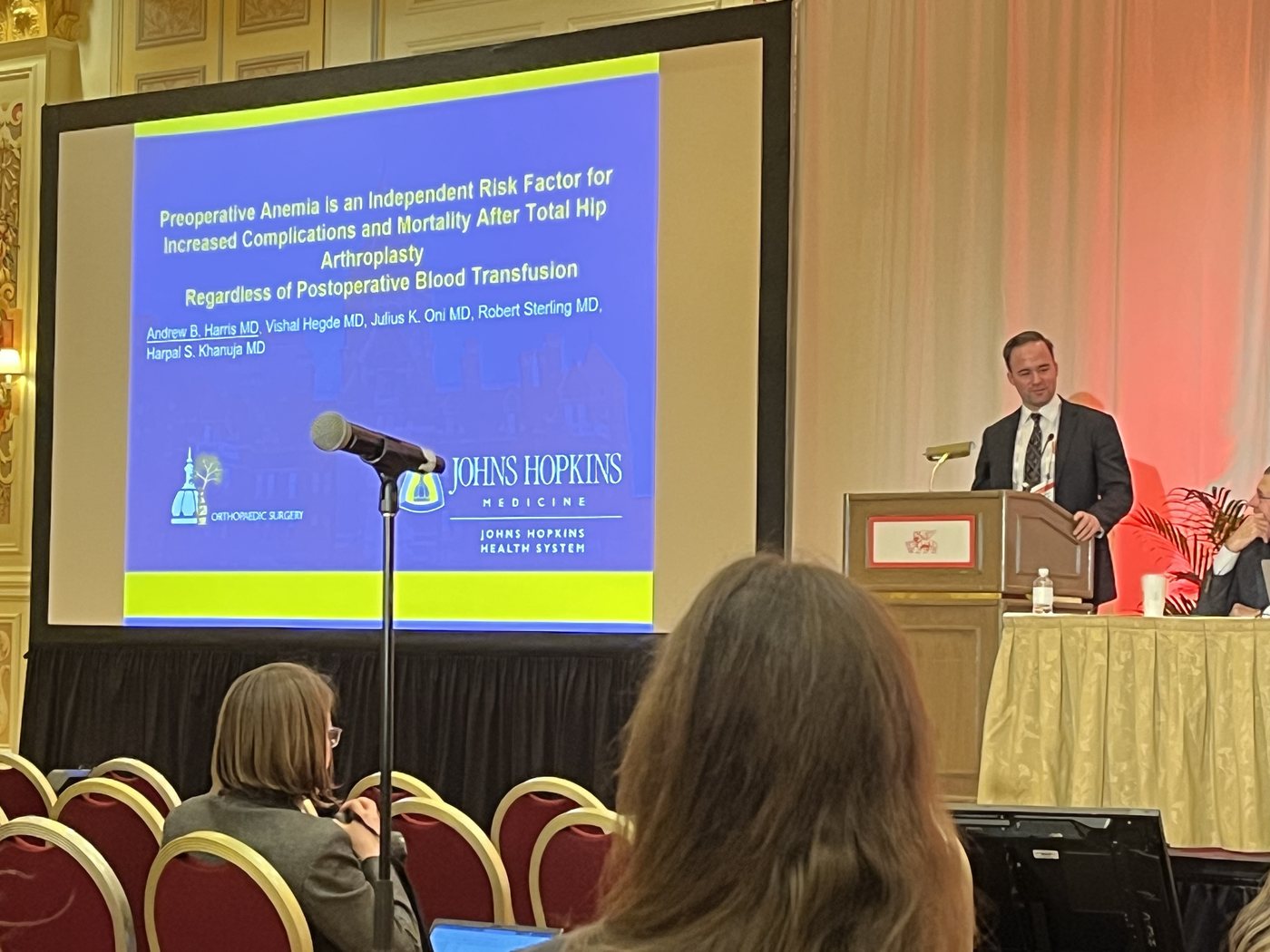 Dr. Andrew Harris presenting hip replacement research at the AAOS Annual Meeting
