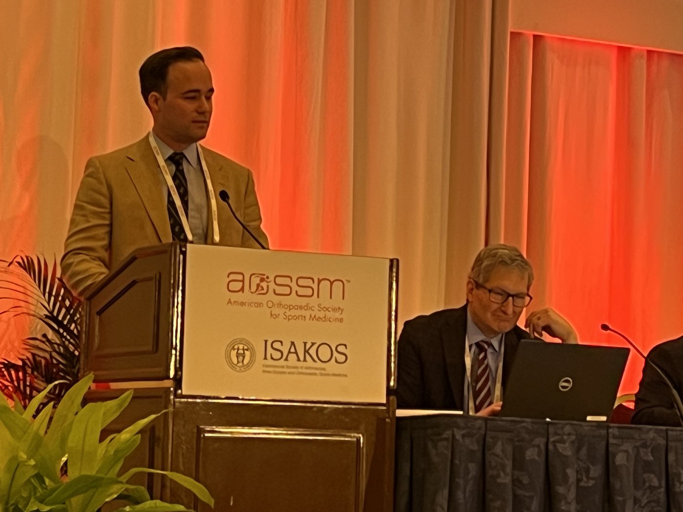 Dr. Andrew Harris presenting at an international orthopaedic meeting