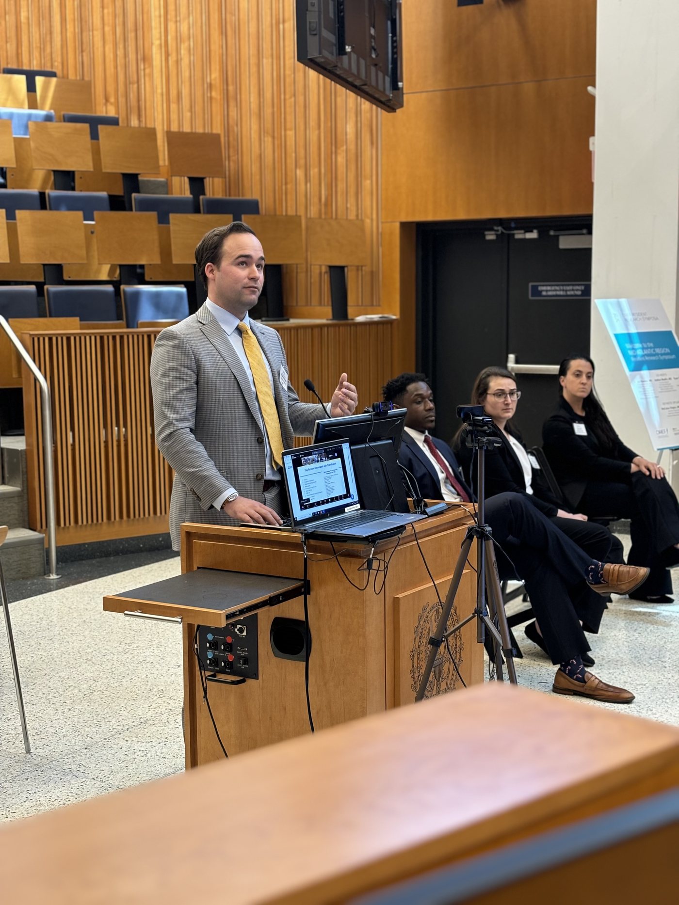 Dr. Andrew Harris presenting orthopaedic research at a national meeting